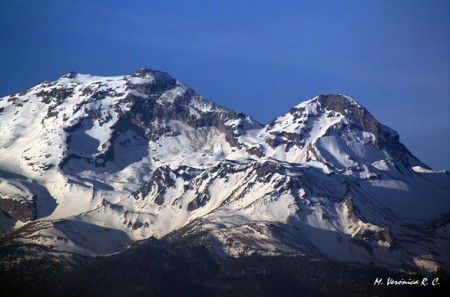 A closer view of Iztaccíhuatl volcano covered with snow A closer view of Iztaccíhuatl volcano covered with snow
